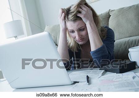 Stressed young woman with hands in hair View Large Photo Image Stock Photograph - Stressed young woman with hands in hair. Fotosearch