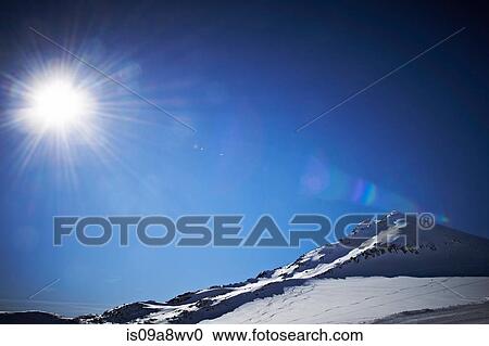 Sunlit, snowcapped mountain in Austria View Large Photo Image Stock Image - Sunlit, snowcapped mountain in Austria. Fotosearch