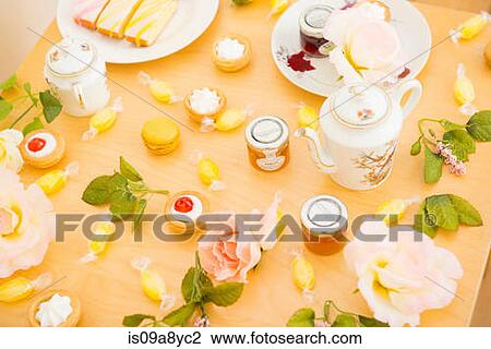 Table with assortment of cakes and confectionery View Large Photo Image Stock Image - Table with assortment of cakes and confectionery. Fotosearch