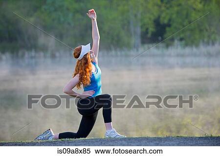 Stock Photography - Teenage girl in sportswear stretching. Fotosearch