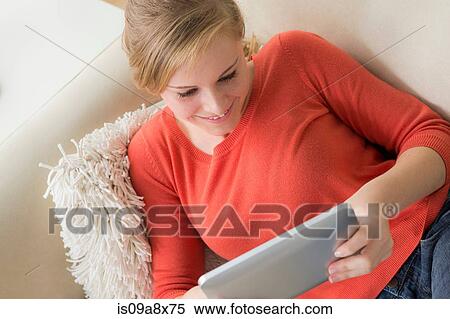 Stock Photography - Teenage girl with digital tablet. Fotosearch
