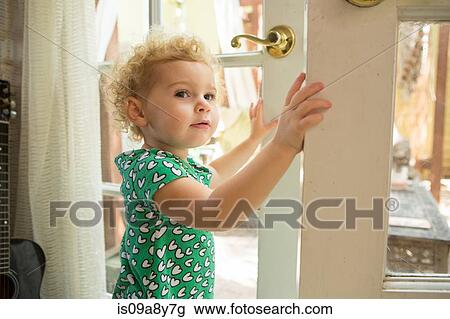 Toddler opening door View Large Photo Image Stock Image - Toddler opening door. Fotosearch