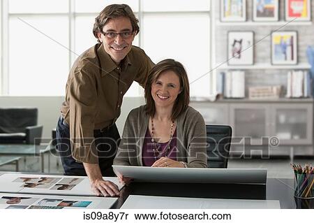 Stock Photography - Two people looking at camera. Fotosearch