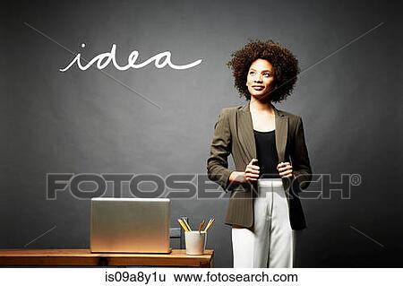 Stock Photograph - Woman and the word idea. Fotosearch