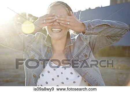 Woman covering eyes View Large Photo Image Stock Photo - Woman covering eyes. Fotosearch