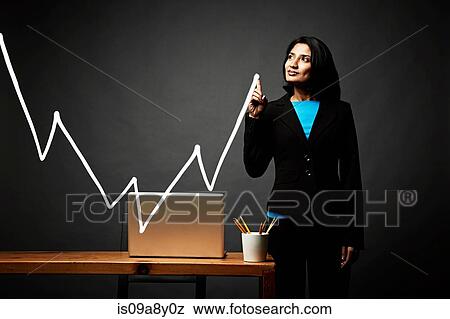Woman drawing line graph View Large Photo Image Stock Photo - Woman drawing line graph. Fotosearch
