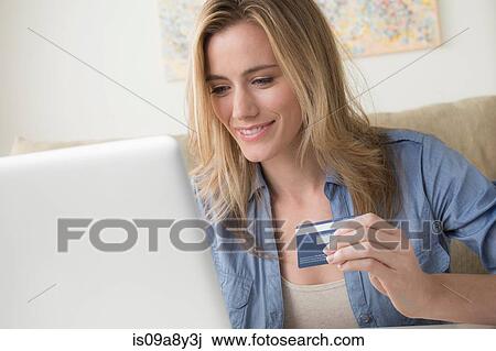 Woman holding credit card View Large Photo Image Stock Image - Woman holding credit card. Fotosearch