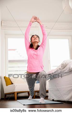Woman in yoga pose looking upward View Large Photo Image Stock Photograph - Woman in yoga pose looking upward. Fotosearch