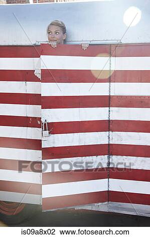 Woman looking over top of door View Large Photo Image Stock Image - Woman looking over top of door. Fotosearch