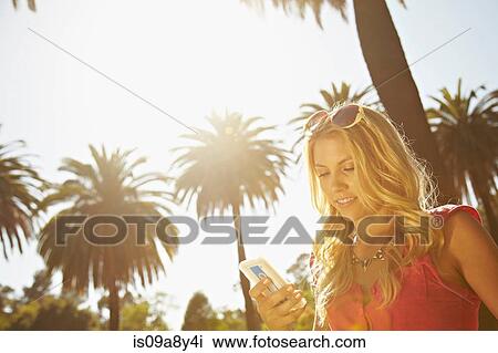 Woman reading text message View Large Photo Image Stock Image - Woman reading text message. Fotosearch