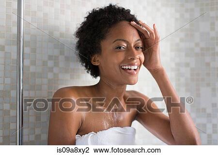 Stock Image - Woman relaxing after bath. Fotosearch