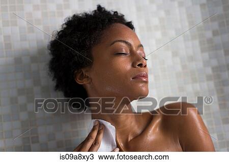 Stock Image - Woman relaxing after bath. Fotosearch