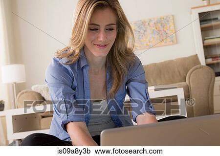 Stock Image - Woman using laptop. Fotosearch
