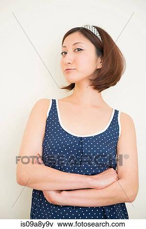 Stock Photo - Woman wearing polka dots in haughty pose. Fotosearch