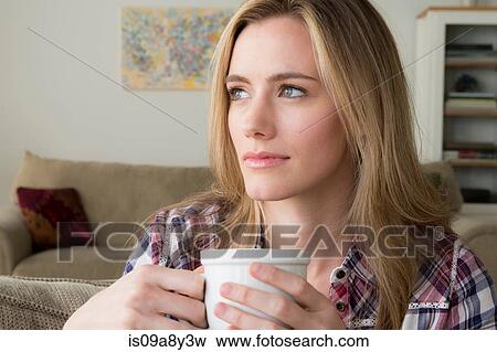 Woman with cup day dreaming View Large Photo Image Stock Photo - Woman with cup day dreaming. Fotosearch