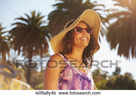 Woman with hat and sunglasses View Large Photo Image Stock Image - Woman with hat and sunglasses. Fotosearch