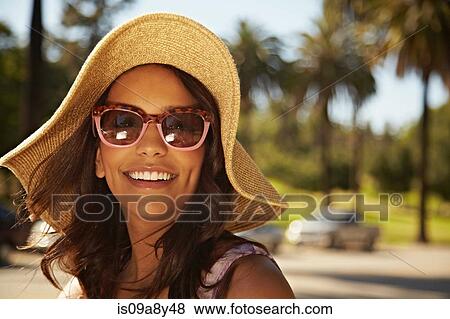 Woman with hat and sunglasses View Large Photo Image Stock Photo - Woman with hat and sunglasses. Fotosearch