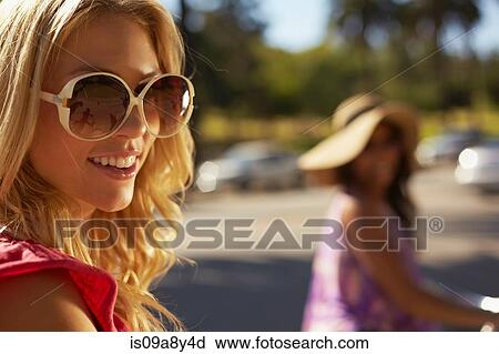 Women on bicycle laughing View Large Photo Image Stock Image - Women on bicycle laughing. Fotosearch