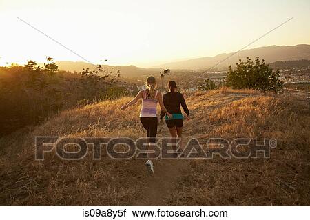 Women walking on dry landscape View Large Photo Image Stock Image - Women walking on dry landscape. Fotosearch