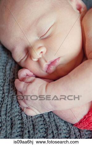 Baby boy lying on grey blanket, sleeping View Large Photo Image Stock Image - Baby boy lying on grey blanket, sleeping. Fotosearch
