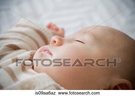 Stock Photo - Baby boy sleeping, close up. Fotosearch