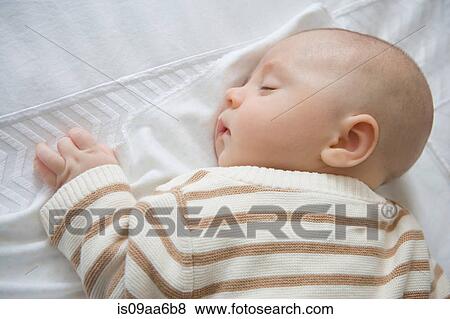 Baby boy sleeping, close up View Large Photo Image Stock Photo - Baby boy sleeping, close up. Fotosearch