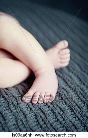 Baby Boys Feet On Grey Blanket Close Up Baby Boys Feet On Grey Blanket Close Up
