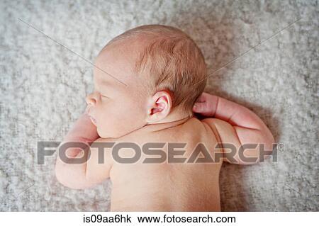 Stock Image - Baby boy's sleeping on blanket. Fotosearch