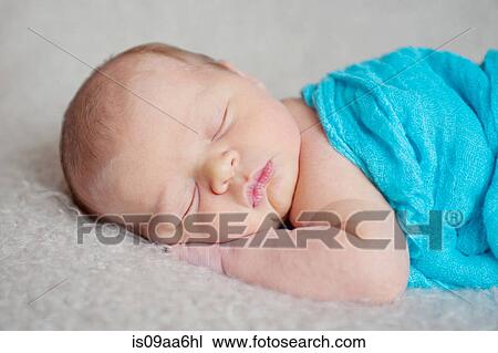 Stock Image - Baby boy's sleeping on blanket. Fotosearch