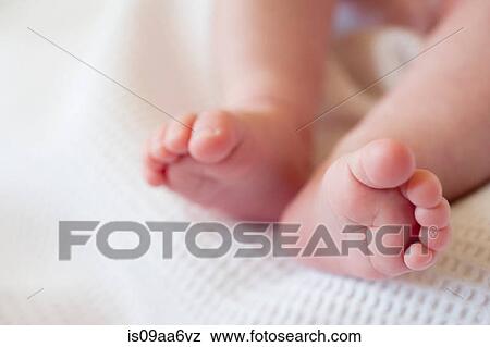 Stock Photo - Baby girl's barefeet, close up. Fotosearch