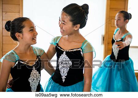 Ballerinas practising in dance studio, smiling View Large Photo Image Stock Image - Ballerinas practising in dance studio, smiling. Fotosearch