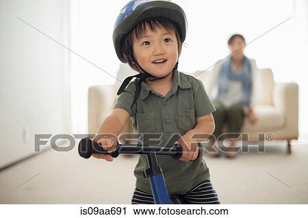 Boy wearing cycling helmet, portrait View Large Photo Image Stock Image - Boy wearing cycling helmet, portrait. Fotosearch