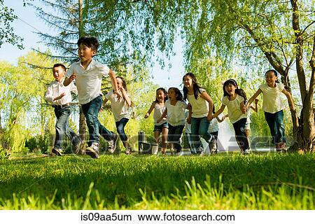 Boys and girls running in park View Large Photo Image Picture - Boys and girls running in park. Fotosearch