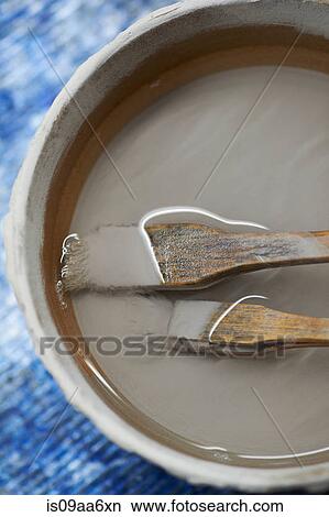 Brushes and clay for traditional Japanese ceramics, overhead view View Large Photo Image Picture - Brushes and clay for traditional Japanese ceramics, overhead view. Fotosearch