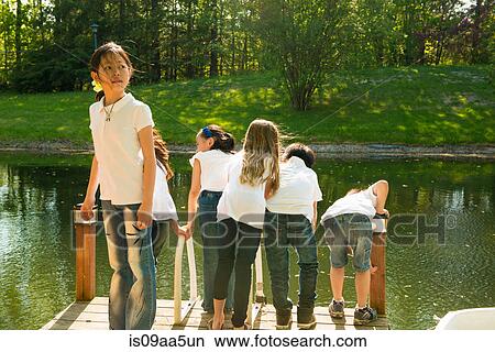 Children on jetty by lake View Large Photo Image Picture - Children on jetty by lake. Fotosearch