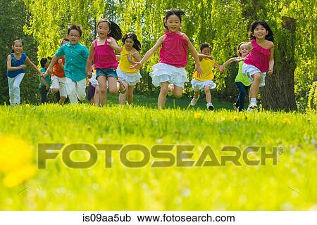 Children running on grass View Large Photo Image Stock Image - Children running on grass. Fotosearch