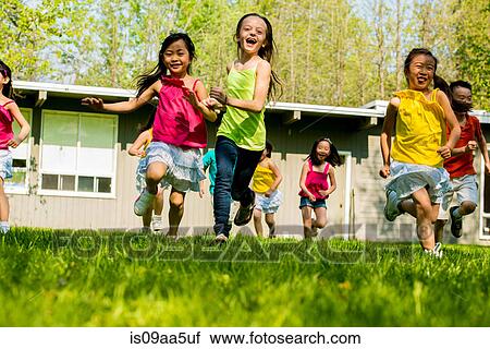 Children running on grass View Large Photo Image Stock Image - Children running on grass. Fotosearch