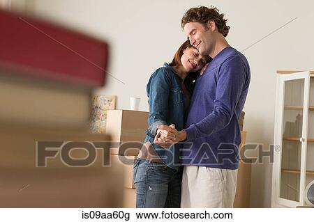 Couple having romantic dance whilst moving house View Large Photo Image Stock Image - Couple having romantic dance whilst moving house. Fotosearch