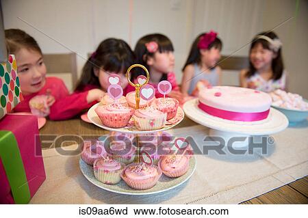Fairy cakes at girl's birthday party View Large Photo Image Stock Image - Fairy cakes at girl's birthday party. Fotosearch