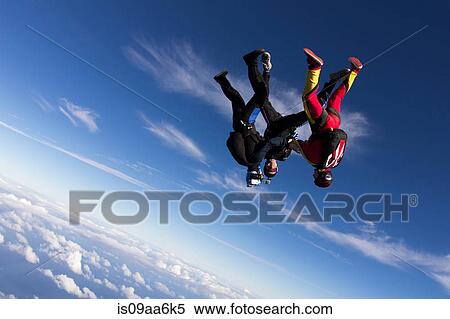 Formation skydivers free falling upside down View Large Photo Image Stock Photography - Formation skydivers free falling upside down. Fotosearch