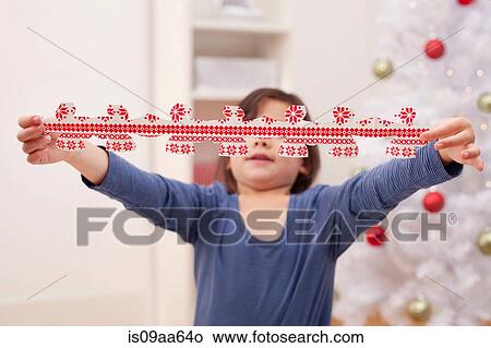 Picture - Girl holding Christmas decoration. Fotosearch