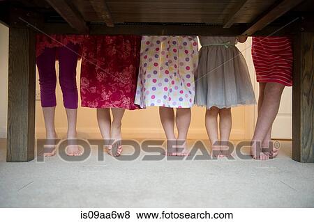 Girls standing together with barefeet in a row, low section View Large Photo Image Stock Photo - Girls standing together with barefeet in a row, low section. Fotosearch