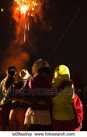 Group of people watching firework display View Large Photo Image Stock Photography - Group of people watching firework display. Fotosearch