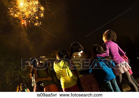 Group of people watching firework display View Large Photo Image Stock Photography - Group of people watching firework display. Fotosearch