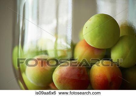 Stock Photograph - Heap of fresh green apples in bowl. Fotosearch