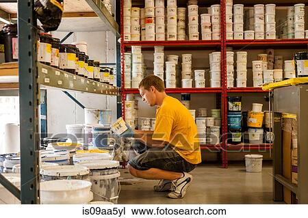 Man looking for ink in screen print workshop View Large Photo Image Stock Image - Man looking for ink in screen print workshop. Fotosearch