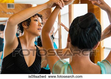 Stock Image - Mature ballet teacher with ballerinas. Fotosearch