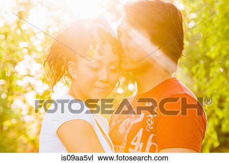 Stock Image - Mature couple in sunlight. Fotosearch