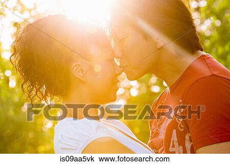 Mature couple kising in sunlight View Large Photo Image Stock Image - Mature couple kising in sunlight. Fotosearch
