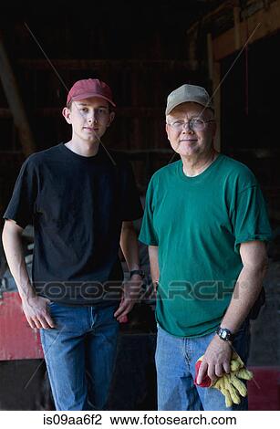 Mature farmer and son in barn, portrait View Large Photo Image Stock Image - Mature farmer and son in barn, portrait. Fotosearch